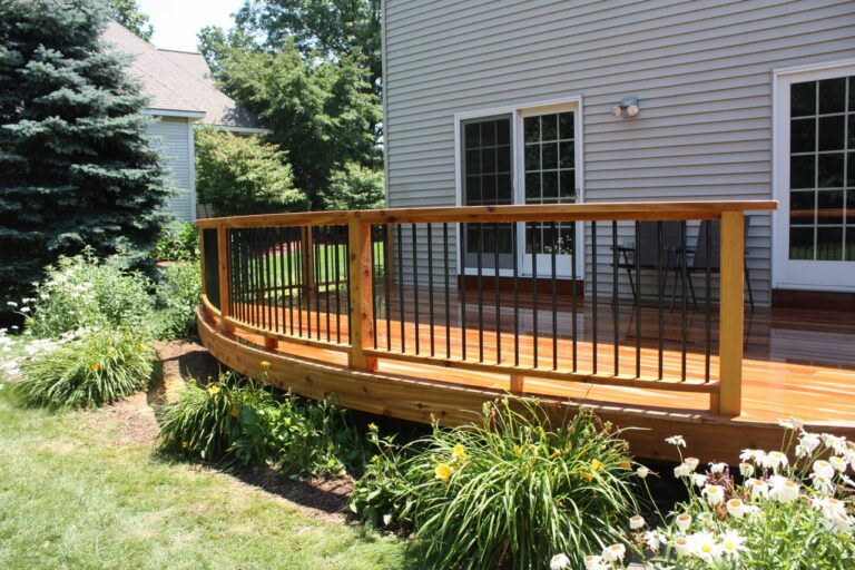 What to do with under deck space? Sometimes it can be used for storage or nothing at all. An elevated deck with plant landscaping underneath.
