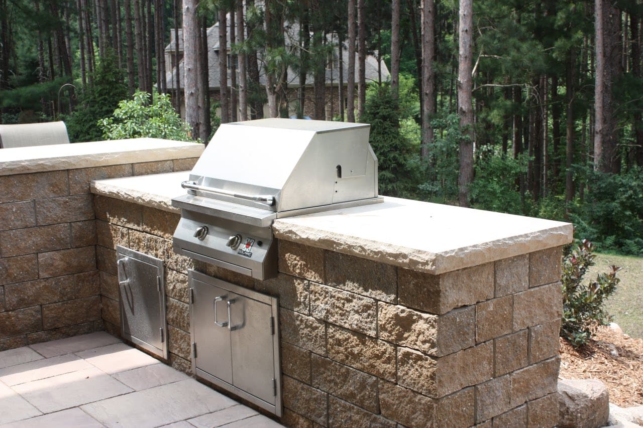 A custom outdoor cooking area done by Precision Decks & Sunrooms. The grilling station is built into the facde, not wheeled out whenever you need a bbq.