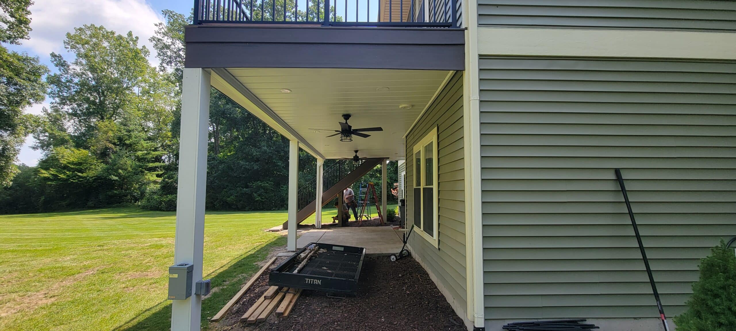 patios under deck ideas - patio under deck being built