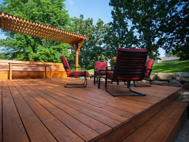 A pergola adds shade to a deck in the late summertime.