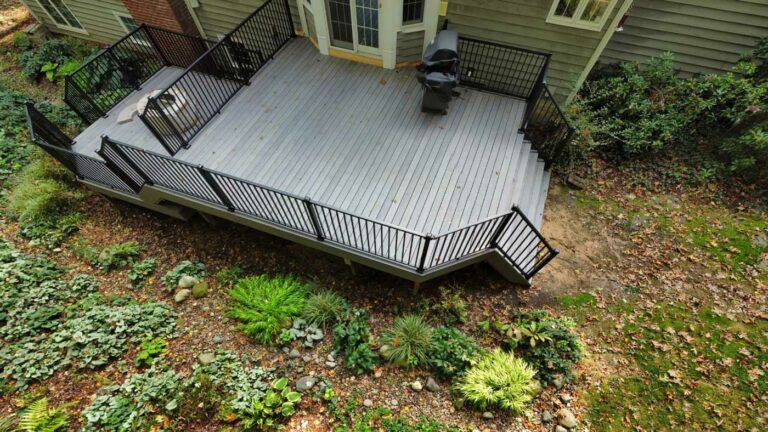 How do you protect you deck from insects? It should be an ongoing effort. A new composite deck built by Precision sits near a wooded area.