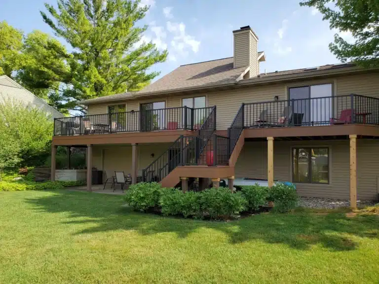 beautiful raised composite deck black railing - Custom deck builders grand rapids michigan