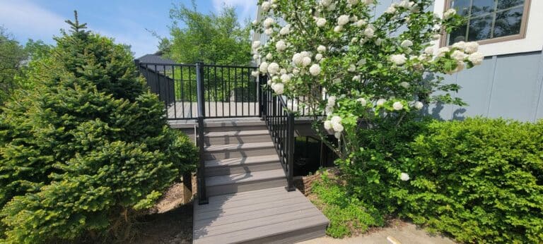 welcoming custom composite deck with black railing in grand rapids michigan