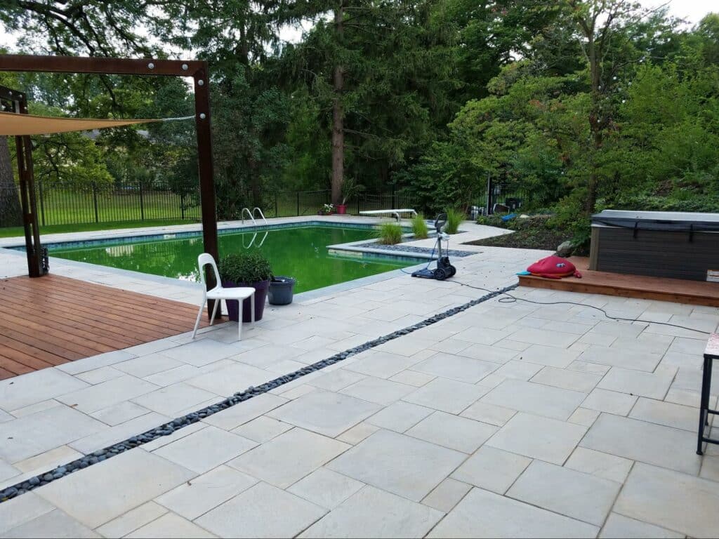 Photo of a pool with stone pavers.