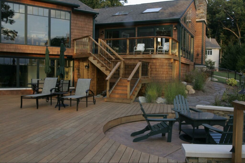 Photo of an elevated wooden deck and wooden patio.