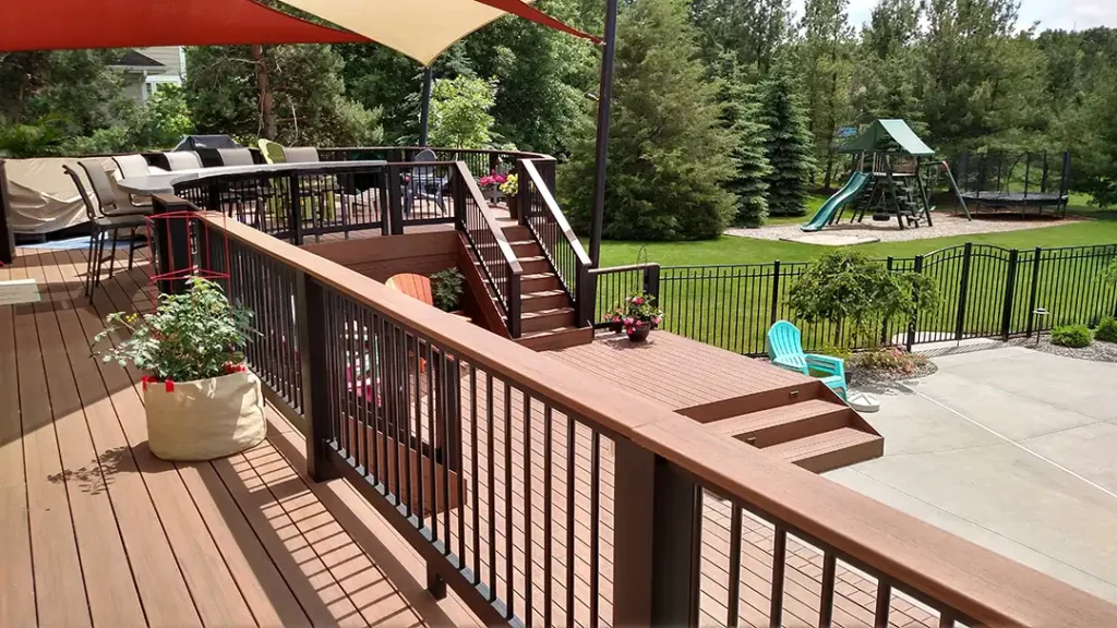 Photo of a multi-level deck with different areas designated for different functions, like sunbathing and outdoor dining.