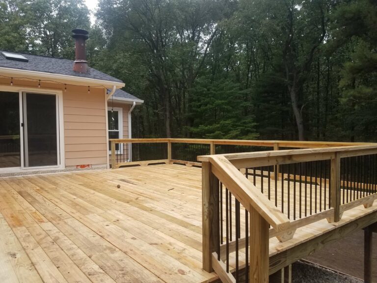 Photo of a traditional wood deck with deck railing.