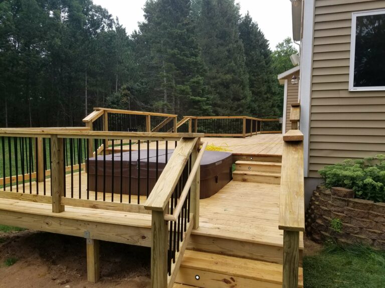 Photo of a traditional wood deck with deck railing.