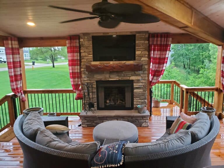 Photo of outdoor fireplace in covered patio