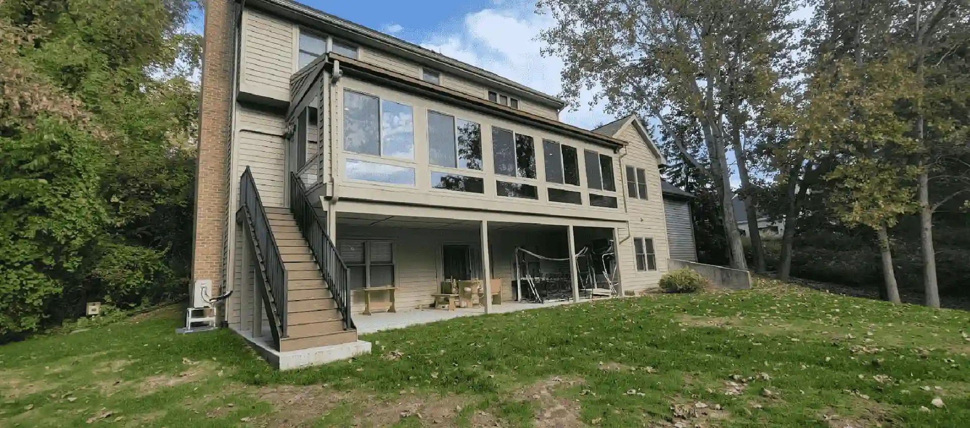 photo of the exterior of a four-season room - Sunrooms Builders in Michigan