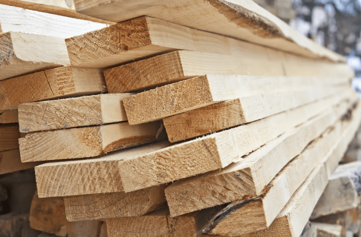 photo of a lumber being manufactured - Treated Wood for decks