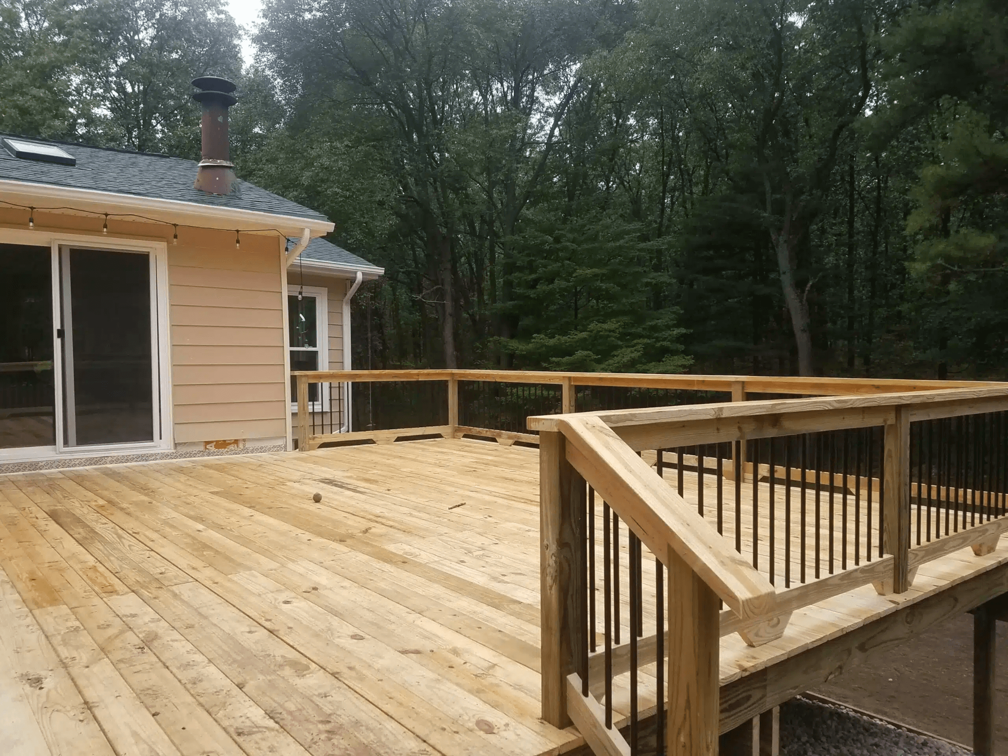 wooden-deck-with-railings-wood-decks-contractor-in-Michigan - Treated wood decks builders in michigan