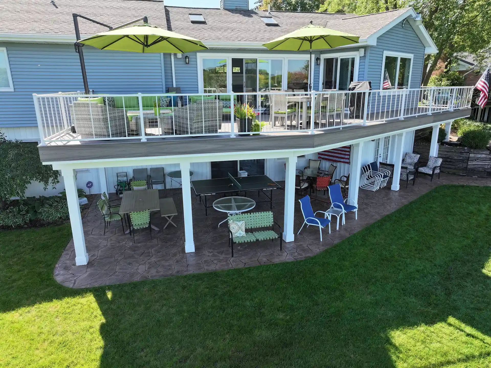 photo of a stamped concrete patio built under an elevated deck