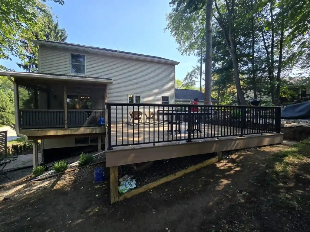 Close-up of the new AZEK deck with a Westbury handrail and drink rail.