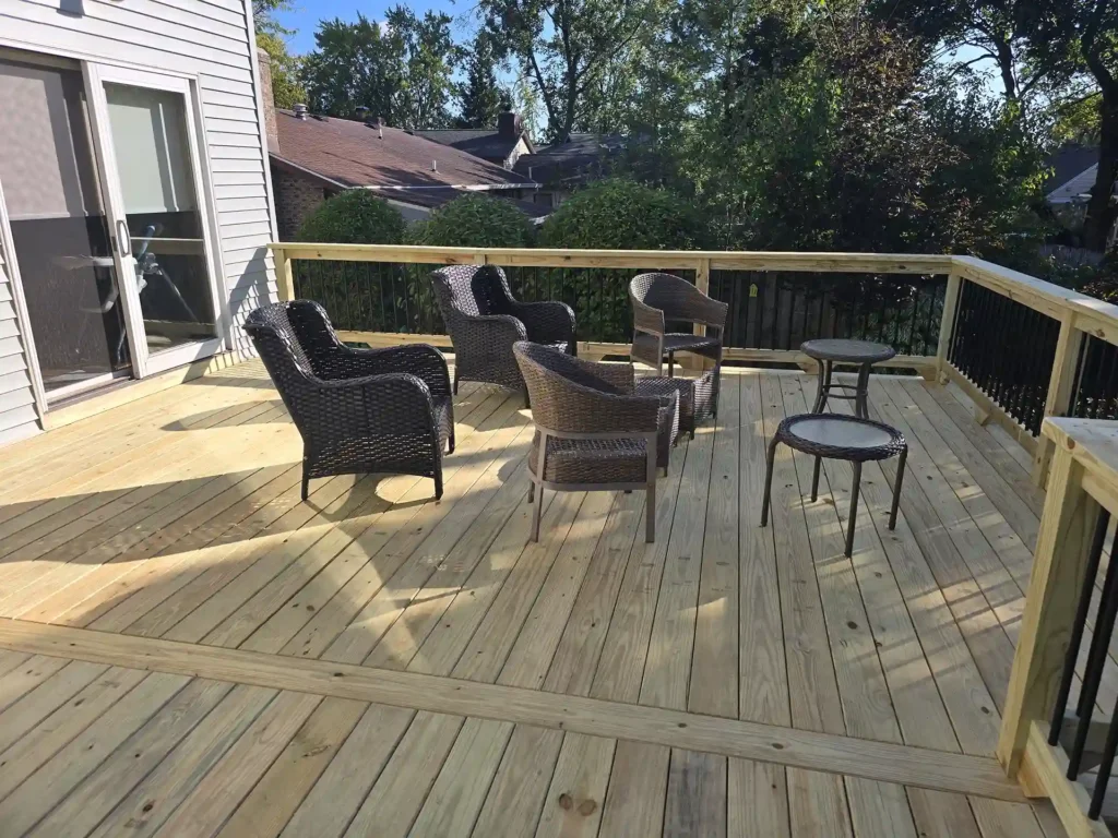 Spacious one-level deck with outdoor furniture and railing detail