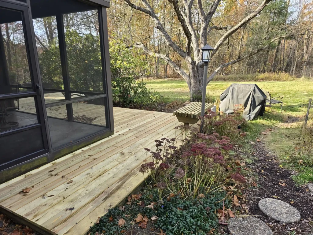 photo of Newly built back deck with pressure-treated wood and built-in benches