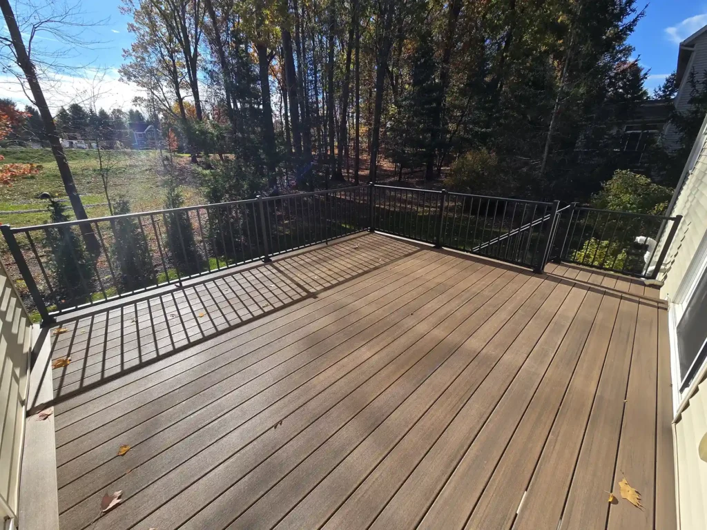 Resurfaced deck with Azek English Walnut, featuring a clean and modern look.