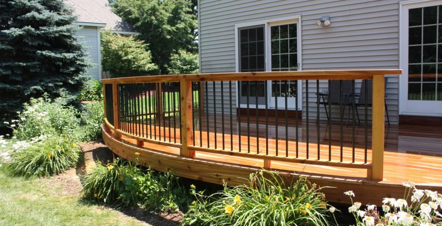What to do with under deck space? Sometimes it can be used for storage or nothing at all. An elevated deck with plant landscaping underneath.