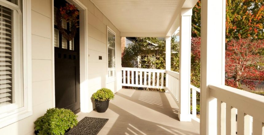 A front porch addition on a country style home, adding more space to relax in warmer seasons.