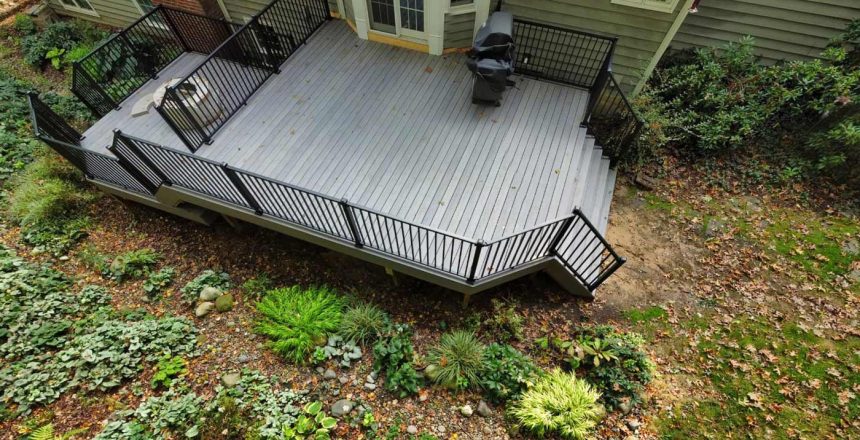 How do you protect you deck from insects? It should be an ongoing effort. A new composite deck built by Precision sits near a wooded area.